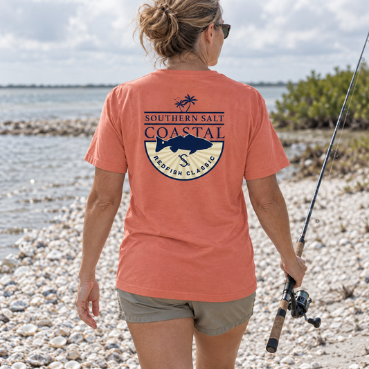 Southern Salt Redfish Classic - Vintage Pocket Tee in NEON RED ORANGE, back artwork in a Gulf Coast lifestyle scene.