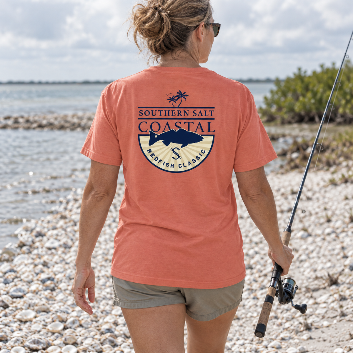 Southern Salt Redfish Classic - Vintage Pocket Tee in NEON RED ORANGE, back artwork in a Gulf Coast lifestyle scene.